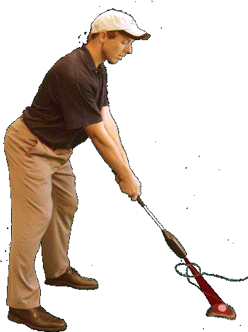 Man about to swing club over base unit